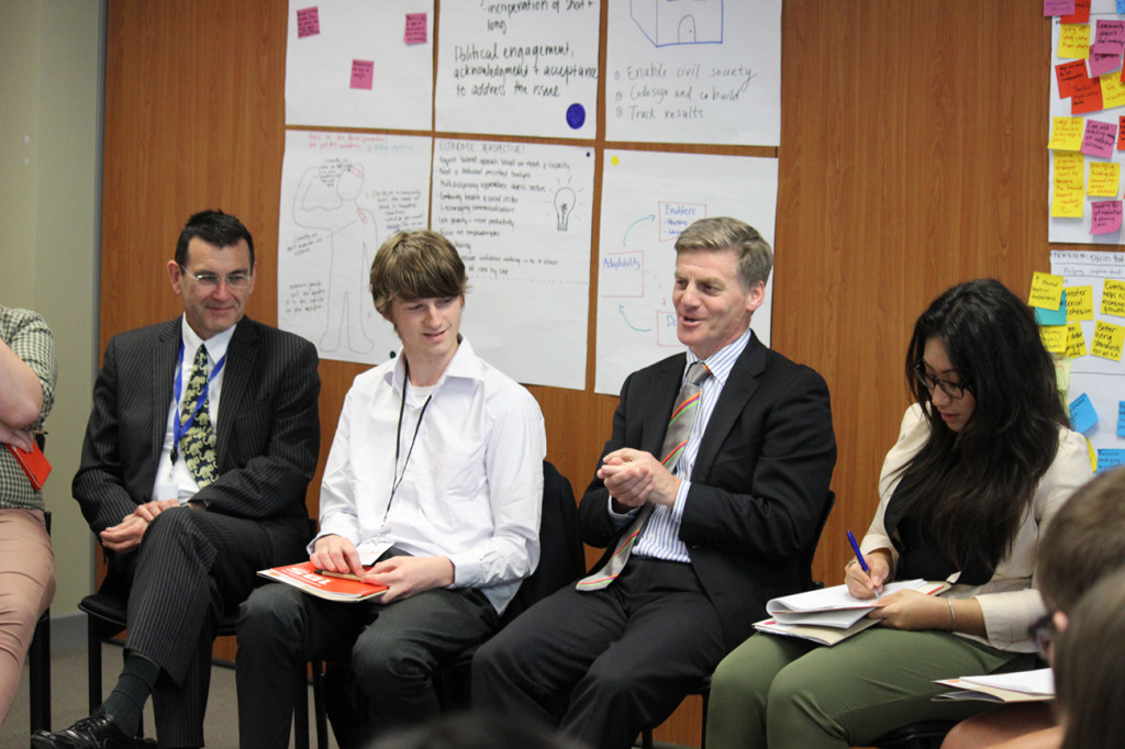 The group has an engaging discussion with Hon. Bill English
